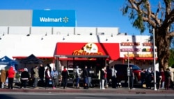 People line up for a COVID-19 test in the Panorama City section of Los Angeles, Jan. 3, 2022.