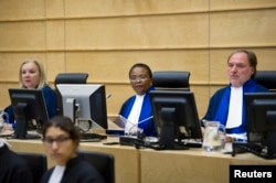 FILE - Judges Sanji Mmasenono Monageng (C) , Sylvia Steiner (L) and Cuno Tarfusser (R) of the International Criminal Court (ICC) attend a meeting about Libya in The Hague, June 27, 2011.