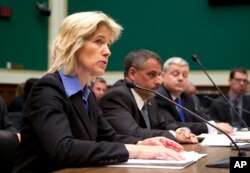 Federal Bureau of Investigation Executive Assistant Director for Science and Technology Amy Hess (L) testifies on Capitol Hill in Washington, April 19, 2016, before a House Oversight and Investigations subcommittee hearing on deciphering the debate over encryption.