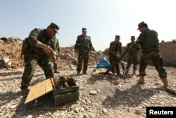 Peshmerga forces gather on the outskirt of Mosul during preparations to attack Mosul, Iraq, Oct.15, 2016.