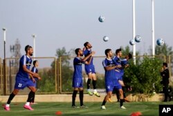 Iran's national men's football team takes part in a training session a day before their Group A match against Syria during the 2018 FIFA World Cup Russia Qualifier, in Tehran, Iran, Sept. 4, 2017.