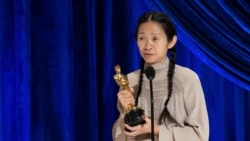 Chloe Zhao accepts one of her awards Sunday night. (Reuters)