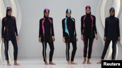 Models present swimwear for Muslim women by Malaysian designer Aktif Bestari at the Islamic Fashion Festival, November 3, 2010.