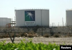 FILE - Oil tanks seen at the Saudi Aramco headquarters during a media tour at Damam city, Nov. 11, 2007.
