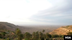 Overlooking a valley in the Nafusa Mountain area, Libya, April 9, 2012. At the far left, white streaks running down the mountain signal oil pipelines buried below. (Stephanie Figgins)
