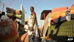 Residents of Juba arrive at the UN compound on December 20, 2013 where they sought shelter. African diplomats made a push for peace in South Sudan on Friday as bitter fighting spread across the world's youngest nation.