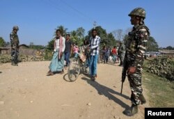 Central Reserve Police Force personnel patrolling ahead of the publication of the first draft of the National Register of Citizens in Juria village in the northeastern state of Assam, India, December 28, 2017.