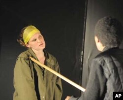 One of the creators of Sky Like Sky, American poet Elizabeth Spackman (left) performs a scene with Rwandan actress Natacha Muziramakenga