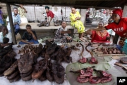 Woman sell monkey meat in a market in Kisangani in the Democratic Republic of Congo. (file photo)