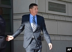Former Trump national security adviser Michael Flynn leaves federal court in Washington, Friday, Dec. 1, 2017.