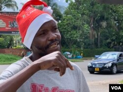 Forty-year-old Clive Mushayi became a street vendor four years ago after losing his job as an automobile mechanic. He says he cannot afford to go to his rural home east of Harare to be with his relatives this Christmas, Dec. 23, 2018. (C. Mavhunga for VOA)