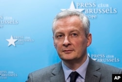 FILE - France's Finance and Economy Minister Bruno Le Maire speaks during a media conference regarding steel tariffs in Brussels, March 12, 2018.