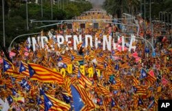 Pro-Independence demonstrators fill-up La Diagonal, one Barcelona's main avenues, during the Catalan National Day in Barcelona, Spain, Sept. 11, 2018.