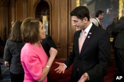 FILE - House Speaker Paul Ryan, R-Wis., talks with House Minority Leader Nancy Pelosi, D-Calif., on Capitol Hill in Washington.