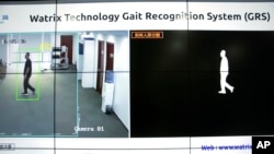 In this Oct. 31, 2018, photo, a screen displays images of a Watrix employee walking during a demonstration of their firm's gait recognition software at their company's offices in Beijing, China. (AP Photo/Mark Schiefelbein)