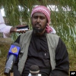 Al-Shabab spokesperson Ali Mohamud Rage holds a news conference in Mogadishu, Somalia, threatening Kenya, October 17, 2011.
