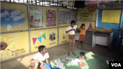 Students put on their uniforms once they arrive at school in the morning.