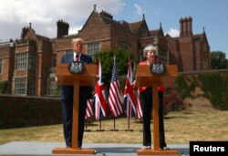 Britain's Prime Minister Theresa May and U.S. President Donald Trump hold a joint news conference at Chequers, the official country residence of the Prime Minister, near Aylesbury, Britain.