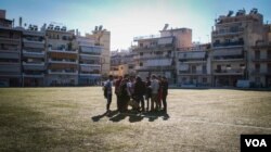 The team huddle together after the trials before returning back home, Nov. 11, 2016. (J. Owens/VOA)