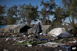 A youth walks toward Serbia's border with Croatia, in Berkasovo, Serbia, Oct. 25, 2015. Thousands of migrants and refugees are still crossing from Serbia into Croatia and continuing their journey towards Western Europe.