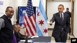 President Barack Obama arrives to cast a ballot at the Dr. Martin Luther King Community Service Center in Chicago, Oct. 20, 2014, while participating in early voting.