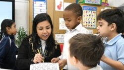 Teaching assistant Dilia Samadova teaches a math lesson in Mrs. Zenobi's kindergarten class at Our Lady of Peace School, Dec.11, 2019.