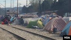 Besides staging sit-ins on the tracks, refugees set up tents to prevent trains from moving, in Idomeni, Greece, March 30, 2016. With no money or any political influence, refugees say it’s the only leverage they have. (H. Murdock/VOA)