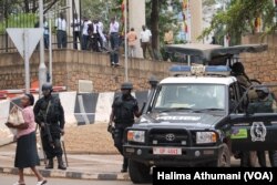 Anti-terrorism police stand guard outside the parliament building in Kampala, Uganda, Sept. 21, 2017, as legislators meet to consider an amendment to the Constitution to lift the presidential age limit.