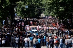 Georgia -- Antigay activists, including Georgian Orthodox priests, march in Tbilisi, May 17, 2017.