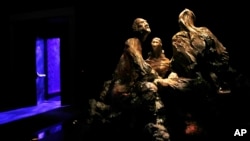 A door opens to the "Exodus" section at the end of the "Passover" presentation inside the Museum of the Bible, Monday, Oct. 30, 2017, in Washington. (AP Photo/Jacquelyn Martin)