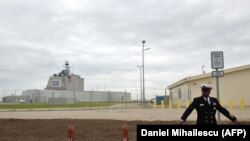ROMANIA -- U.S. Army personnel stands at the red carpet ahead an inauguration ceremony of the U.S. anti-missile station Aegis Ashore Romania (in the background) at the military base in Deveselu, May 12, 2016