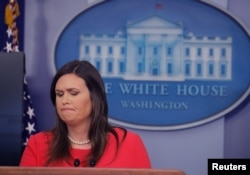 White House press secretary Sarah Sanders addresses reporters during a press briefing at the White House in Washington, Jan. 28, 2019.