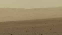 FILE - This color image taken August 8, 2012 from NASA's Curiosity rover, and released August 13, shows part of the wall of Gale Crater, the location on Mars where the rover landed on August 5, 2012.
