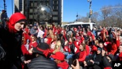 Demonstrators at the International Women's Day rally stage a sit-down protest outside Trump International Hotel at Columbus Circle, March 8, 2017, in New York.