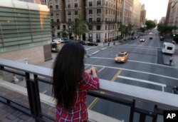 FILE - Sameena, 22, a member of the Indian Dawoodi Bohra community, overlooks Amsterdam Avenue. from a bridge in New York, July 12, 2016. While living her dream of being a graduate student at an Ivy League school in America, Sameena is also coming to terms with the knowledge that she was circumcised at 7. At least 200 million girls and women alive today have undergone some form of female genital cutting, according to the United Nations.