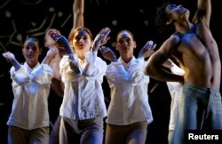 FILE - Members of the Bangarra Dance troupe perform during a photo call in Sydney's Opera House.