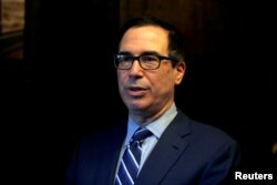 FILE - U.S. Treasury Secretary Steven Mnuchin speaks during an interview with Reuters in Jerusalem, Oct. 21, 2018.