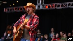 Neil Young performs at the Bridge School Benefit Concert at the Shoreline Amphitheatre, Oct. 20, 2012, in Mountain View, Calif.