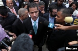 Venezuelan opposition leader Juan Guaido, who many nations have recognized as the country's rightful interim ruler, speaks to the media after a meeting with young leaders at the National Assembly in Caracas, Venezuela, April 4, 2019.