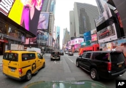 Motorists roll south on 7th Avenue in Times Square, Friday, March 29, 2019, in New York. A congestion toll that would charge drivers to enter New York City's central business district is a first for an American city. (AP photo)