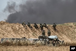 Israeli soldiers are seen during protests along Israel Gaza border, April 20, 2018. Four Palestinians were killed by Israeli troops firing from across the border fence, health officials said.