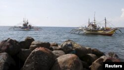 Filipino fishing boats that were sprayed with water by Chinese Coastguard are pictured while anchored at shorelines of the coastal town of Infanta, Pangasinan in northern Philippines April 22, 2015.