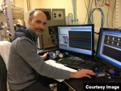 University of Maryland Neuroscientist Patrick Kanold records the neuron activity in the auditory cortex of an adult mouse, the part of the brain that processes hearing. (Photo courtesy Patrick Kanold)