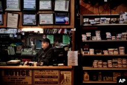 Mark Berns sits in his small engine repair shop in Prairie du Chien, Wis., Jan. 19, 2017.