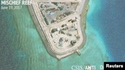 Construction is shown on Mischief Reef in the Spratly Islands, South China Sea, in this June 19, 2017, satellite image released by CSIS Asia Maritime Transparency Initiative at the Center for Strategic and International Studies (CSIS).