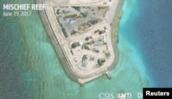 Construction is shown on Mischief Reef in the Spratly Islands, the disputed South China Sea, in this June 19, 2017, satellite image released by CSIS Asia Maritime Transparency Initiative at the Center for Strategic and International Studies.