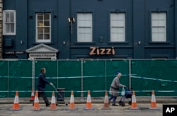 A police cordon and fence are placed outside a Zizzi restaurant near the area where former Russian double agent Sergei Skripal and his daughter were found critically ill following exposure to the Russian-developed nerve agent Novichok in Salisbury, Englan