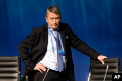 FILE - Former president of the German Soccer Federation DFB, Wolfgang Niersbach, waits for the beginning of a UEFA meeting in Zurich, Switzerland on Feb. 25, 2016.