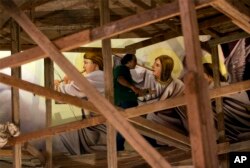 Coptic Christian Ayman William stands on scaffolding inside Mar Girgis Church, in the Zawiya al-Hamra neighborhood of Cairo, Egypt, April 24, 2107. William paints for the glory of God, unfazed by recent attacks against his fellow Coptic Christians in Egypt.