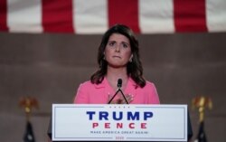 Former U.S. Ambassador to the United Nations Nikki Haley puts her hand over her heart as she speaks to the largely virtual 2020 Republican National Convention in a live address from Washington, U.S., August 24, 2020. REUTERS/Kevin Lamarque